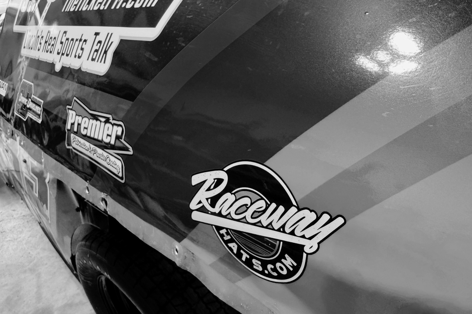 Raceway hats racing logo close up on a real racing car